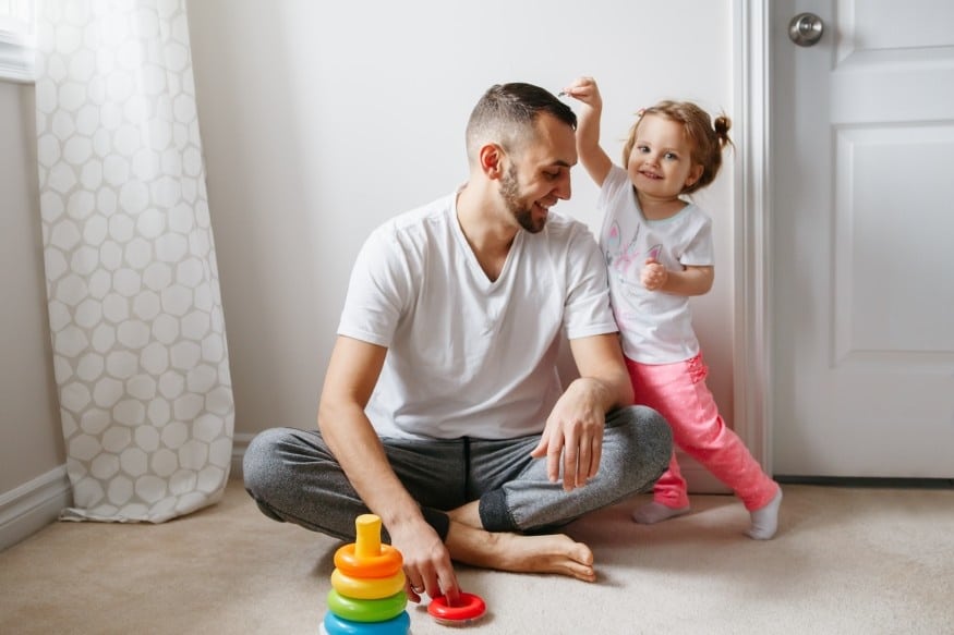 dad playing with daughter