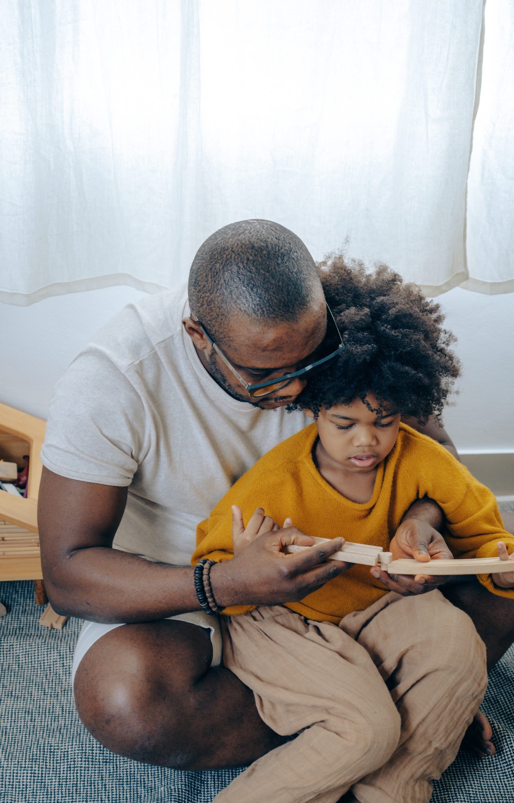 dad reading book with child