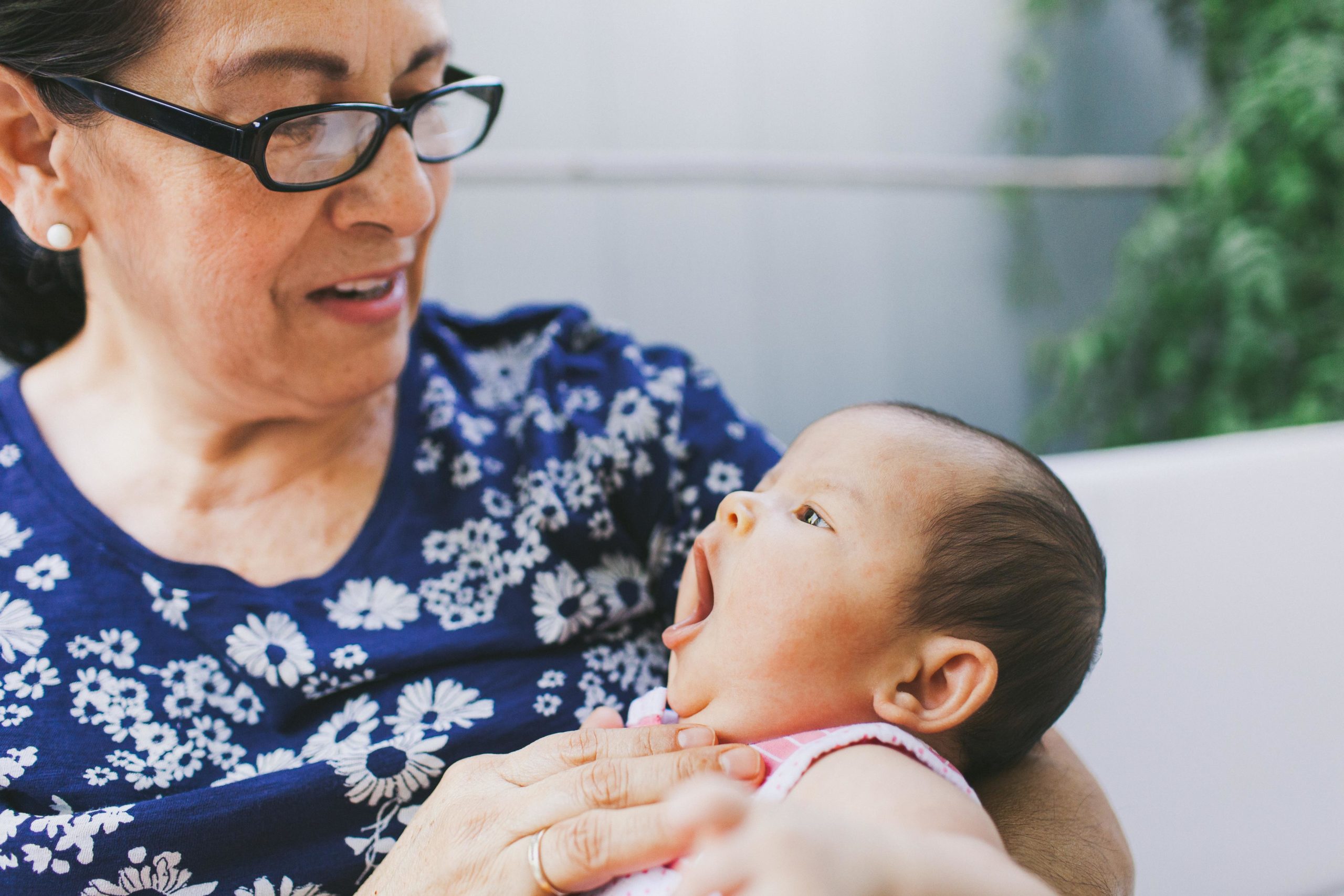 grandma holding new baby