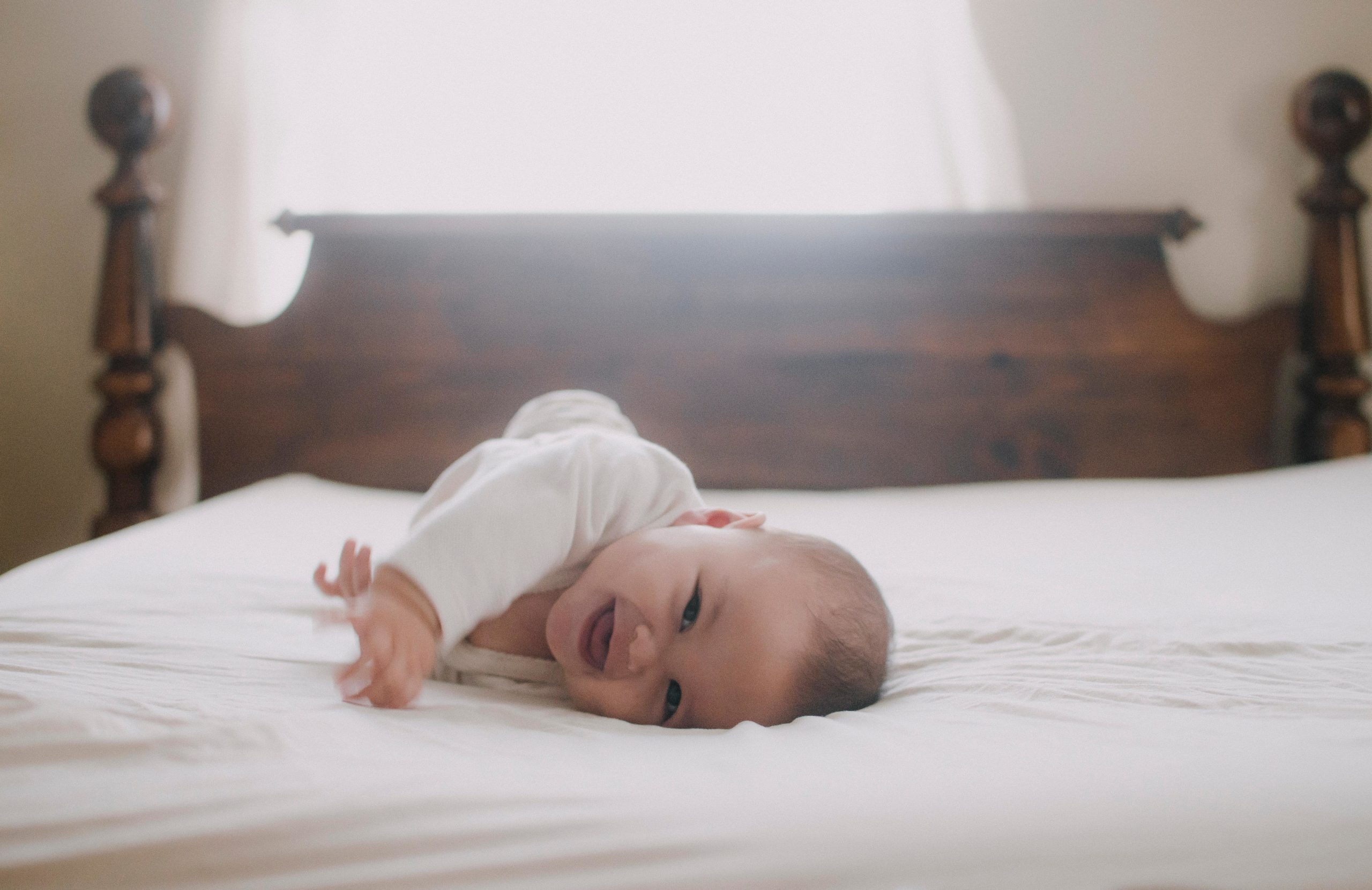 baby laying on the bed