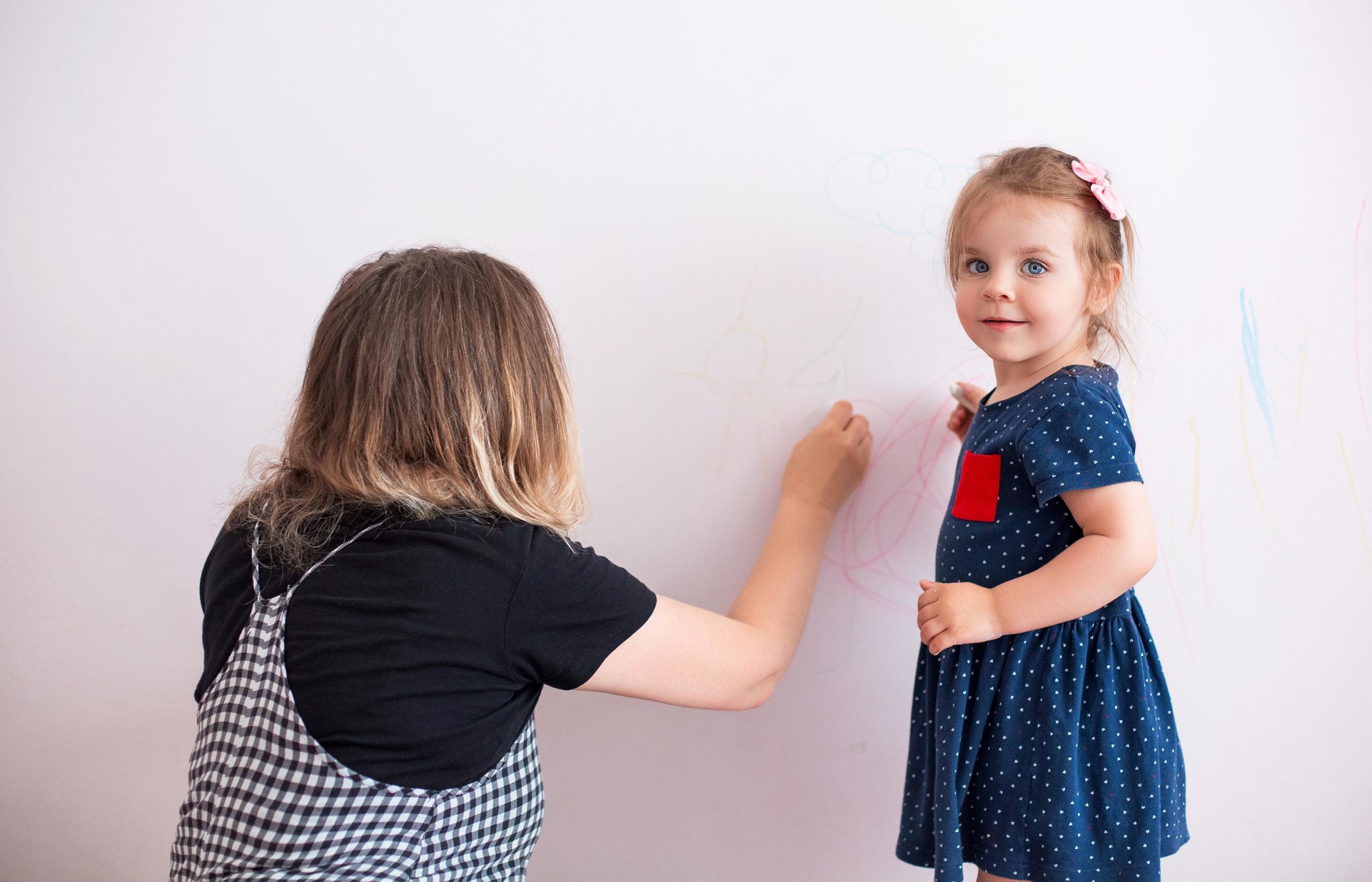 mom playing with little girl