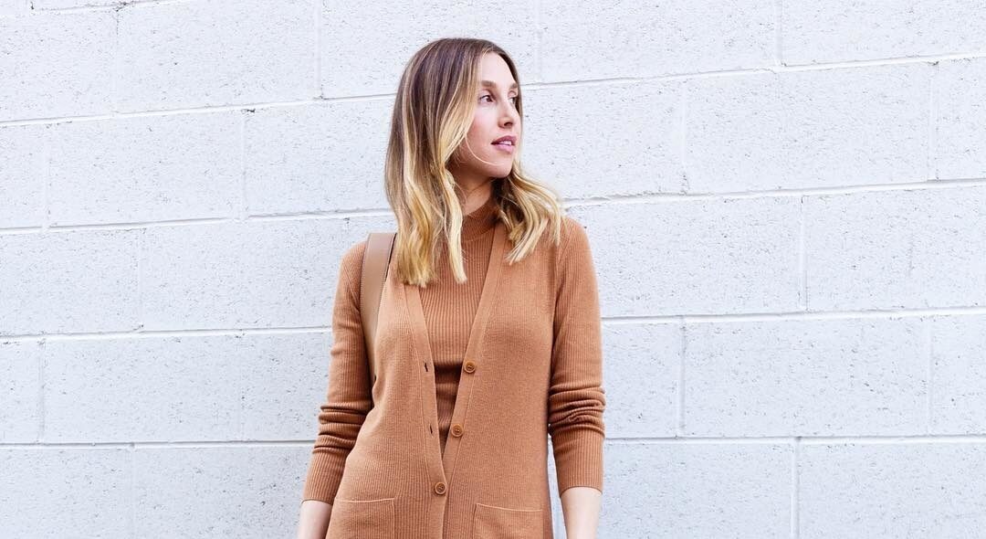 Whitney Port posting in a cardigan