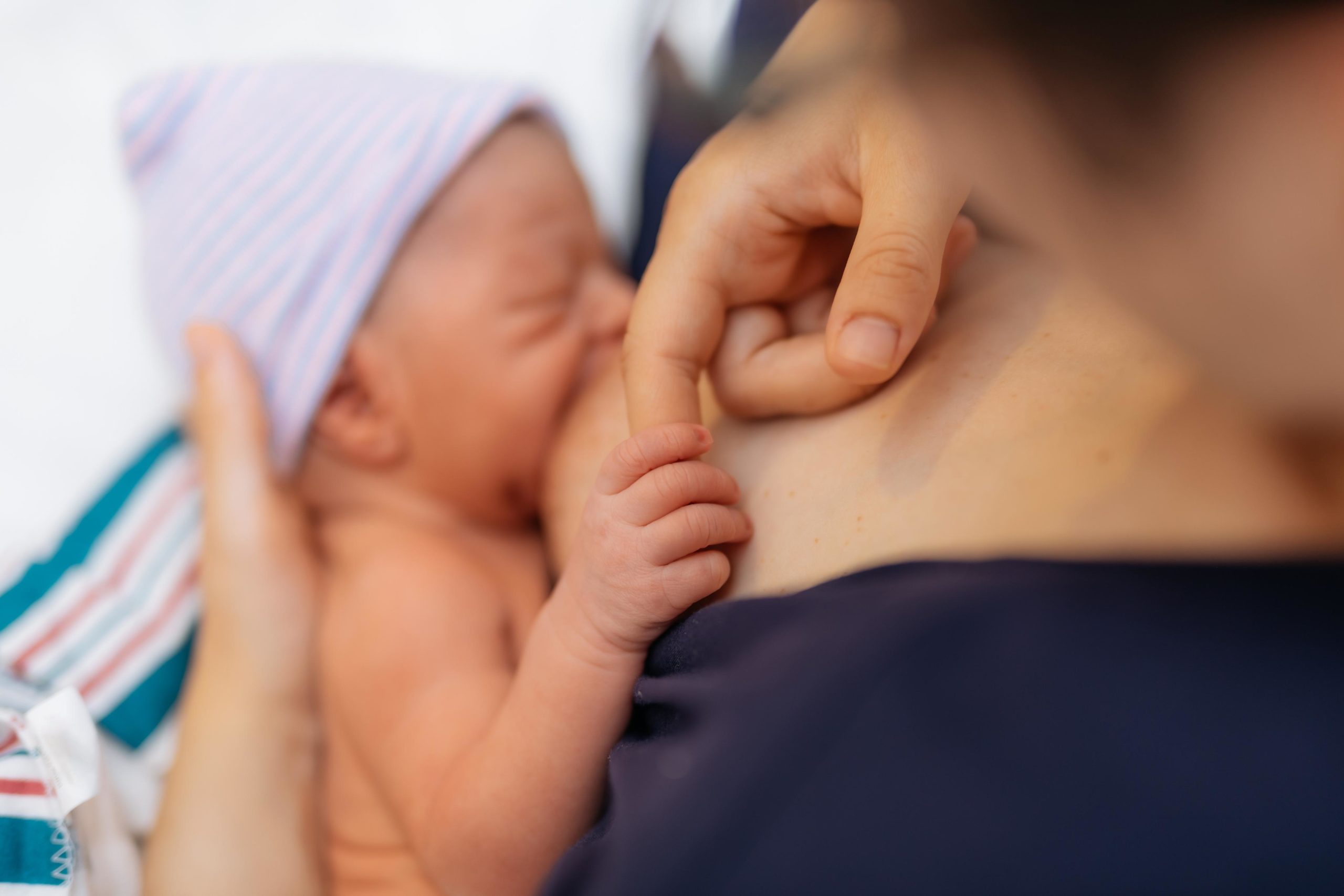 mom breastfeeding a newborn