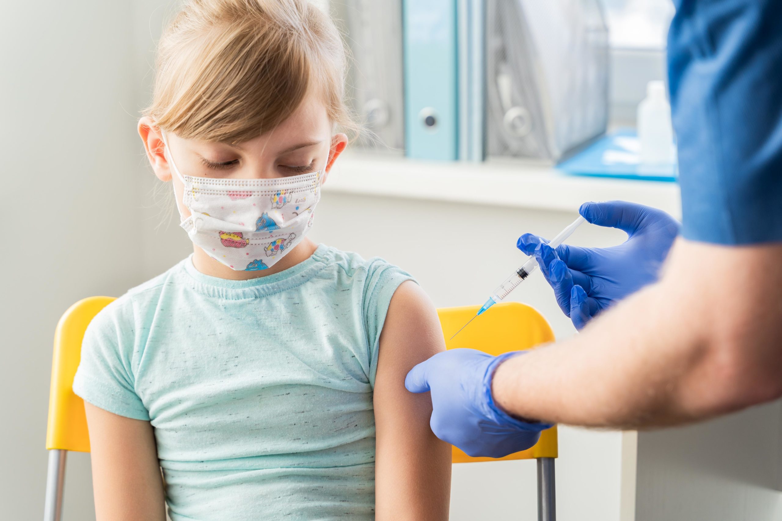 little boy getting vaccine