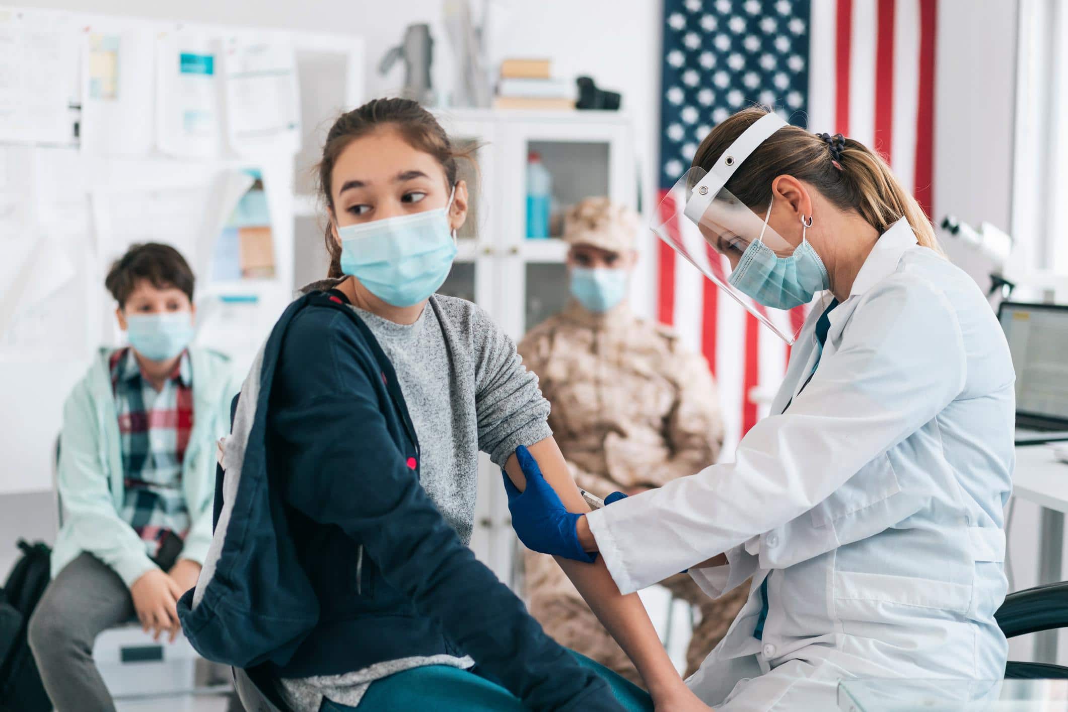 teen girl getting a vaccine