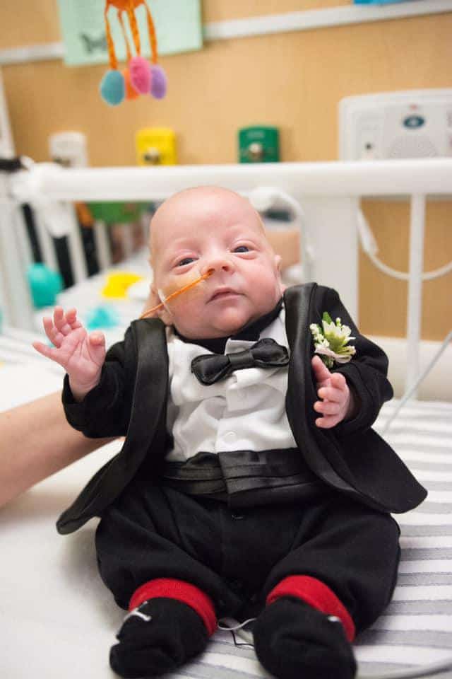 baby in a NICU wearing a tux