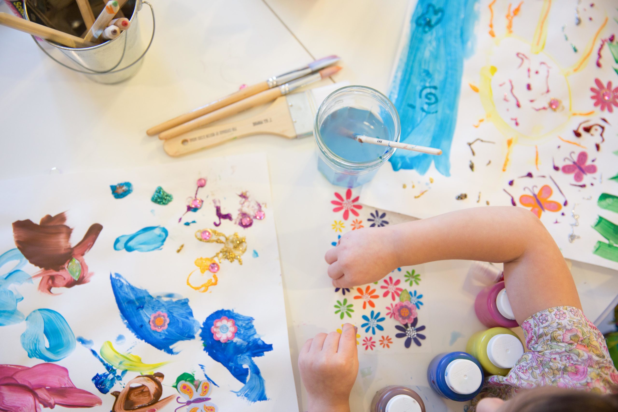 little girl playing with crafts