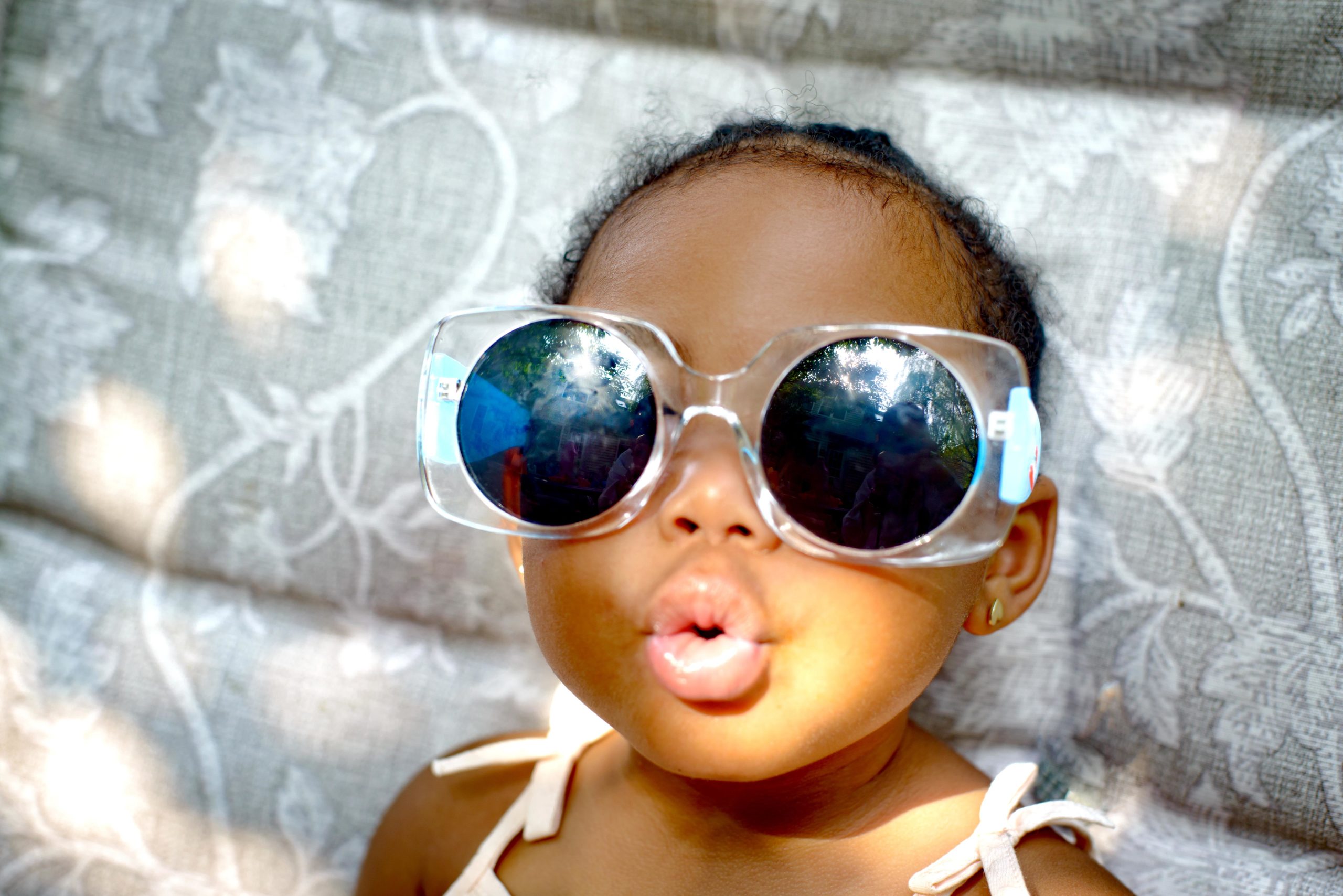 baby girl wearing big sunglasses