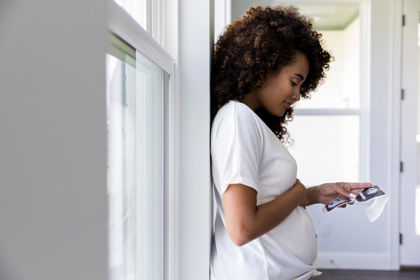 pregnant woman checking her phone