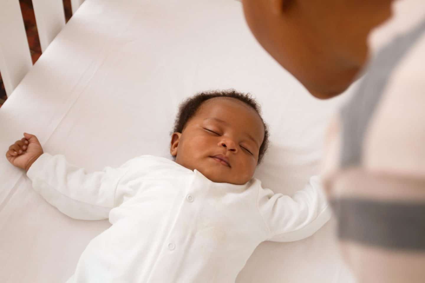 baby sleeping in a bassinet