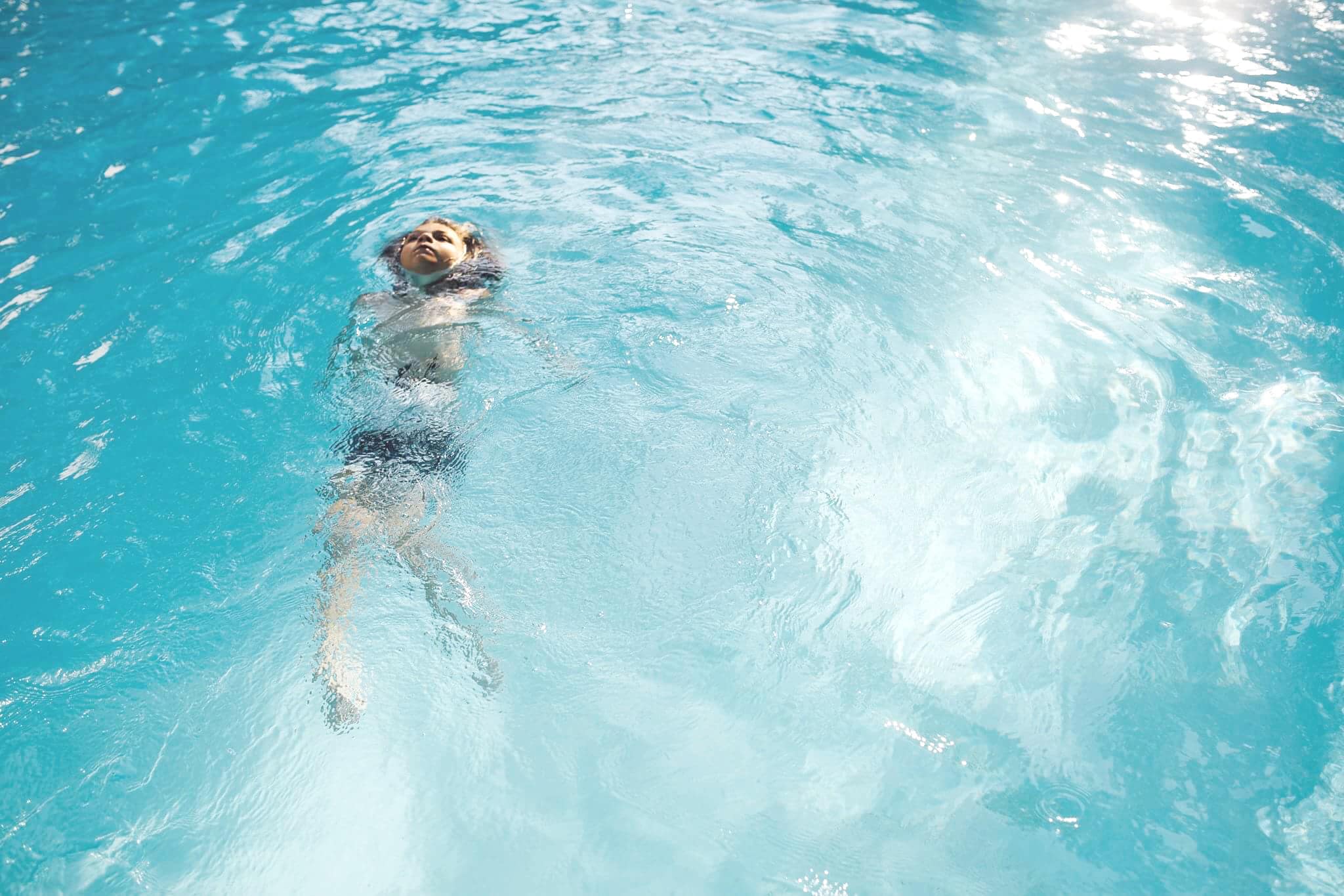 child-swimming-in-a-pool