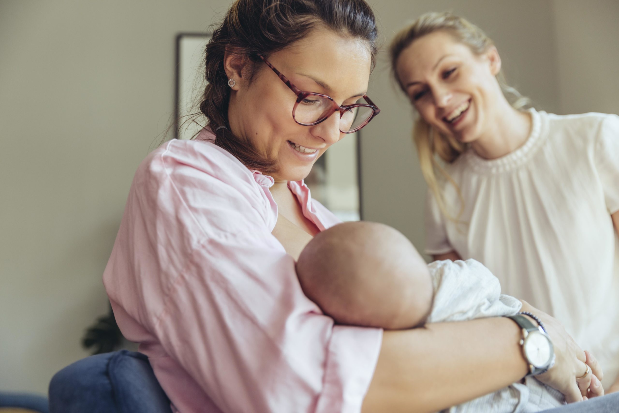 midwife holds baby after birth - what is a midwife?