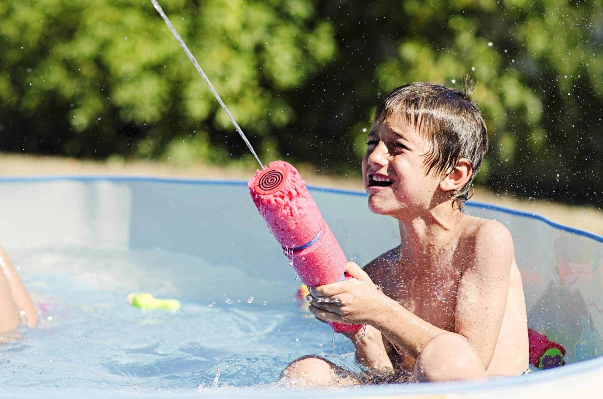 little kid playing with a pool toy- kiddie pool safety