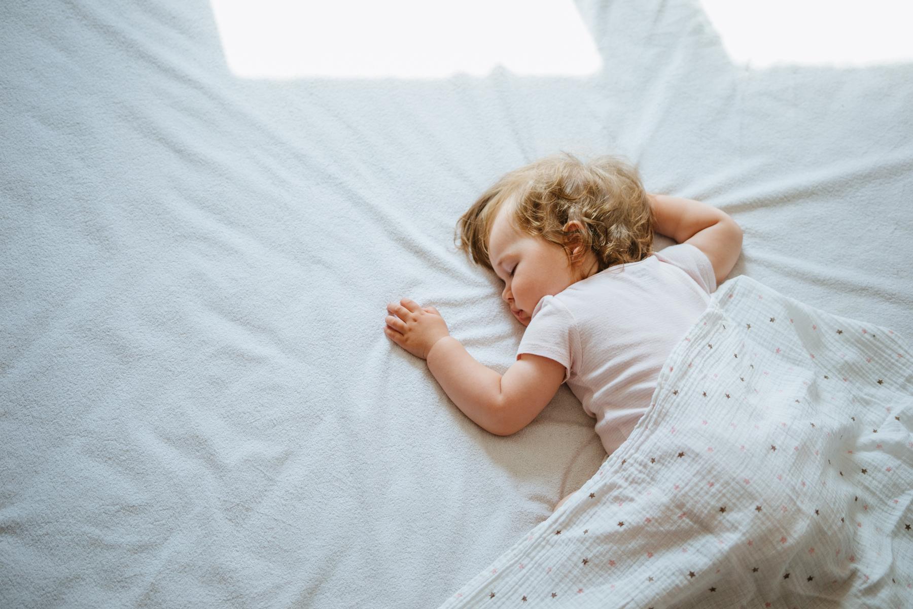 When Is It Safe for My Baby to Sleep with a Blanket?