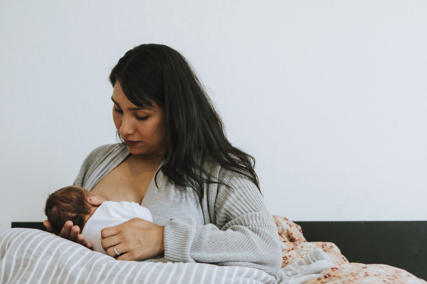 mom breastfeeding newborn
