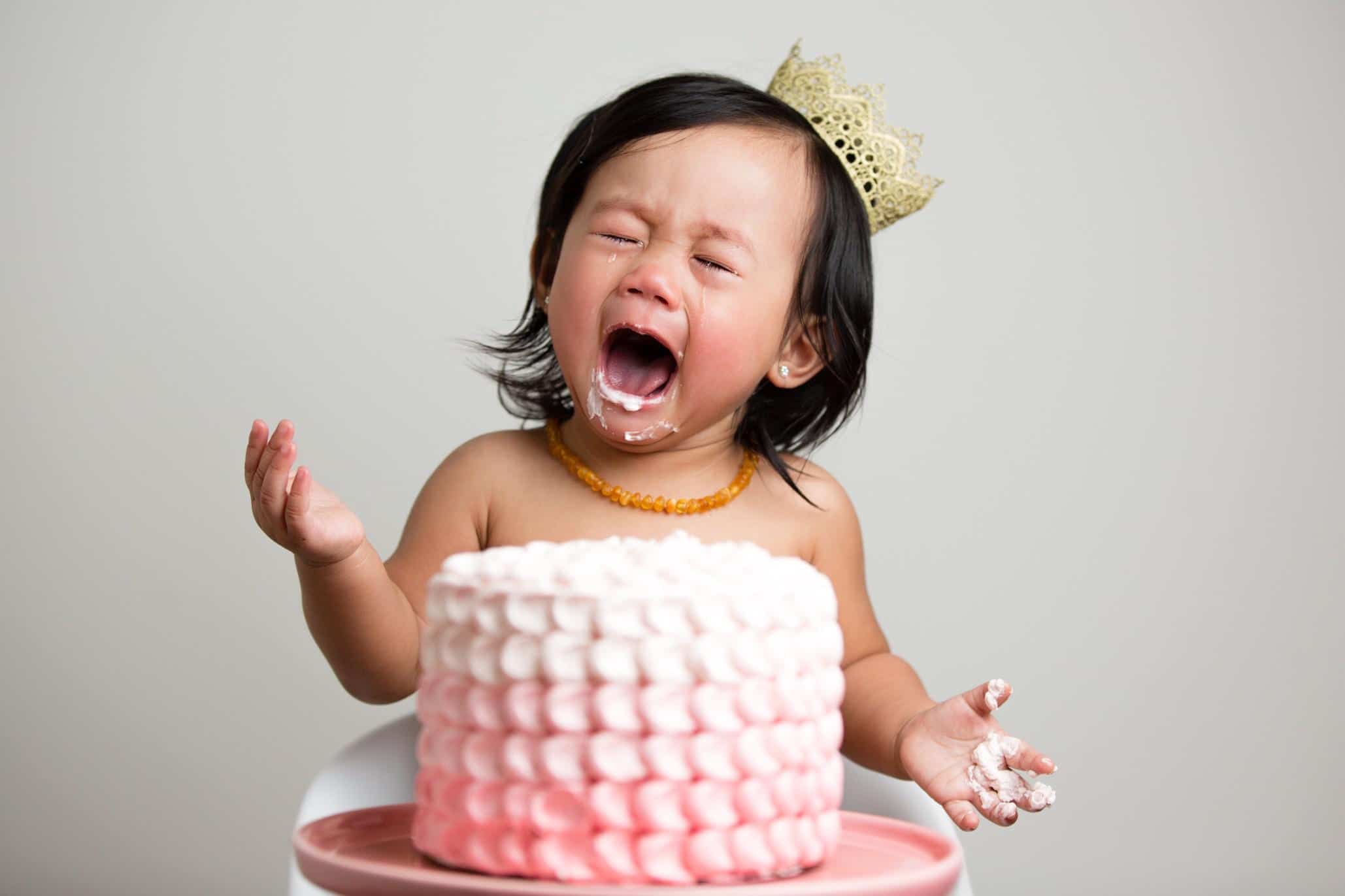 baby eating a cake