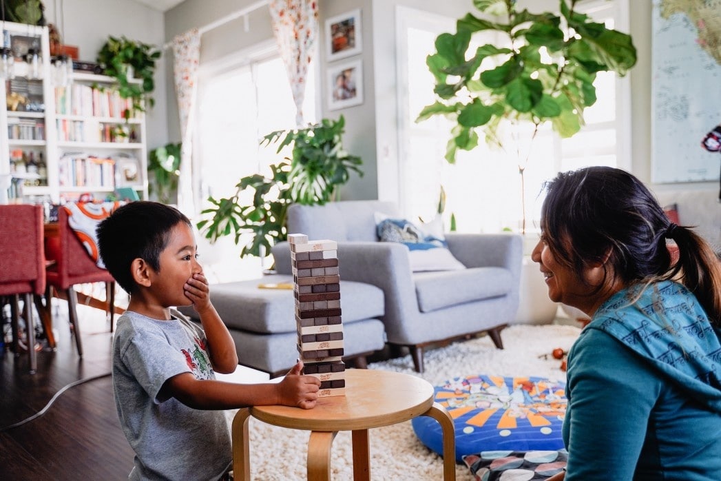 mom and son playing jenga