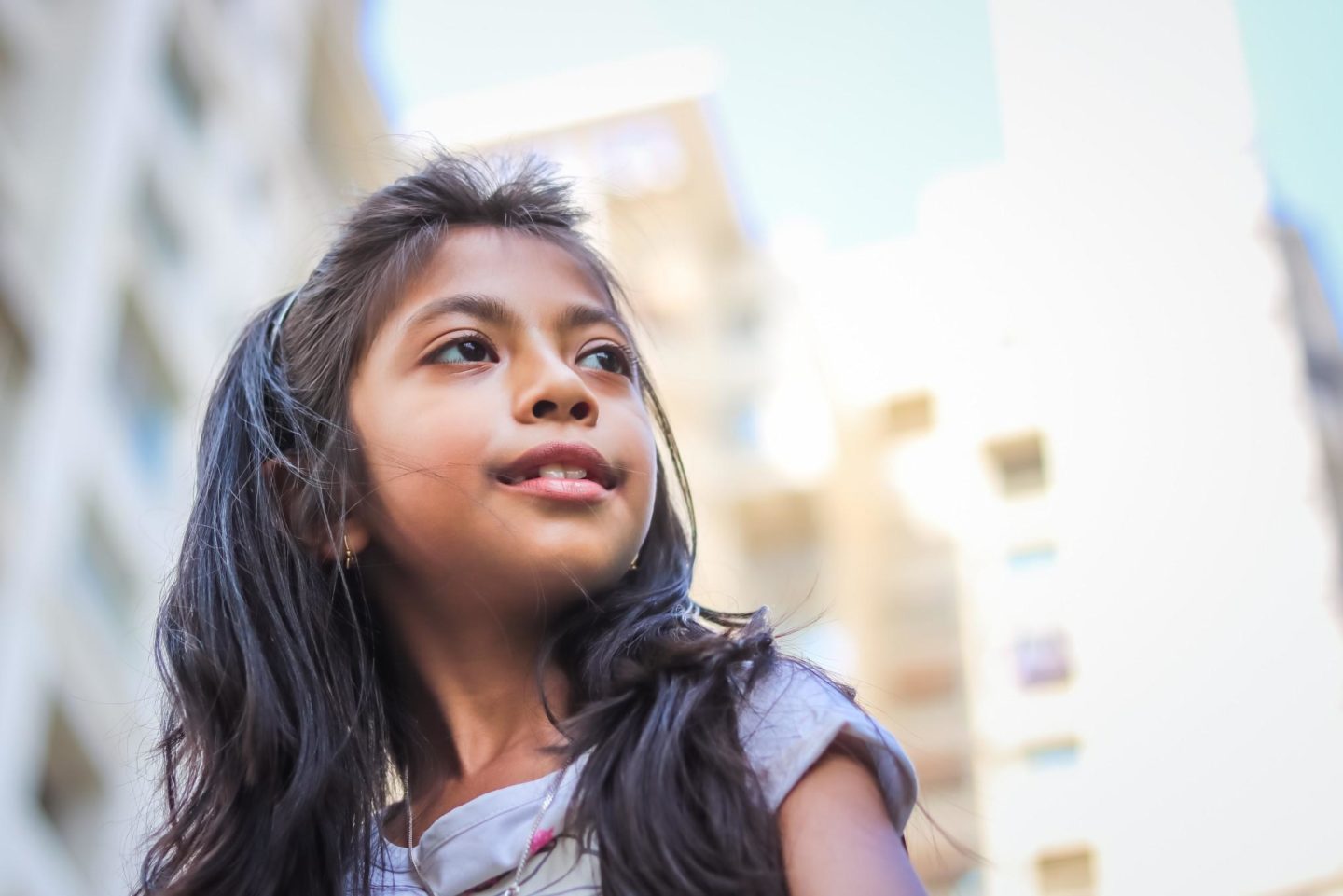 little girl looking up at the sky