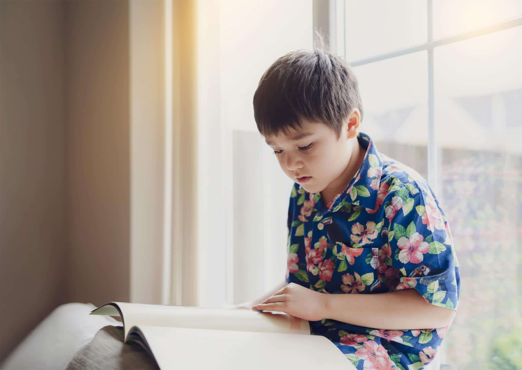 little boy reading - indigenous peoples history