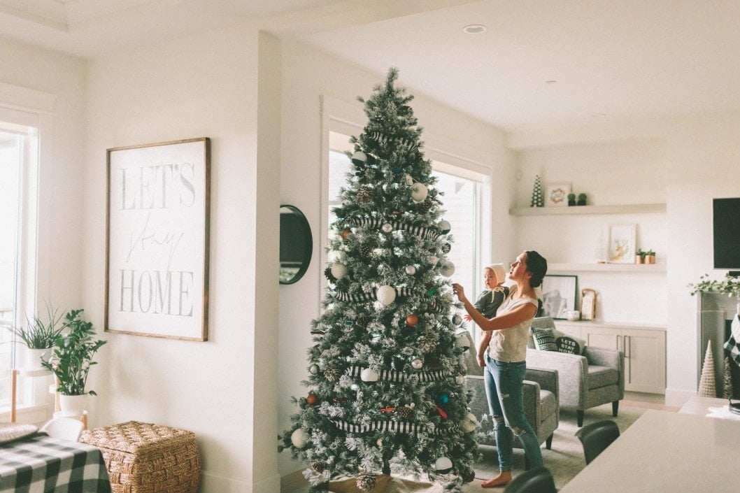 mom showing baby christmas tree