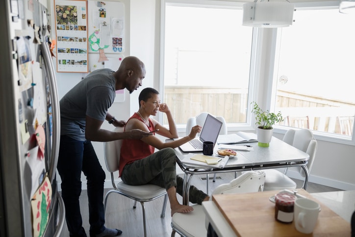 partners sitting in front of a computer