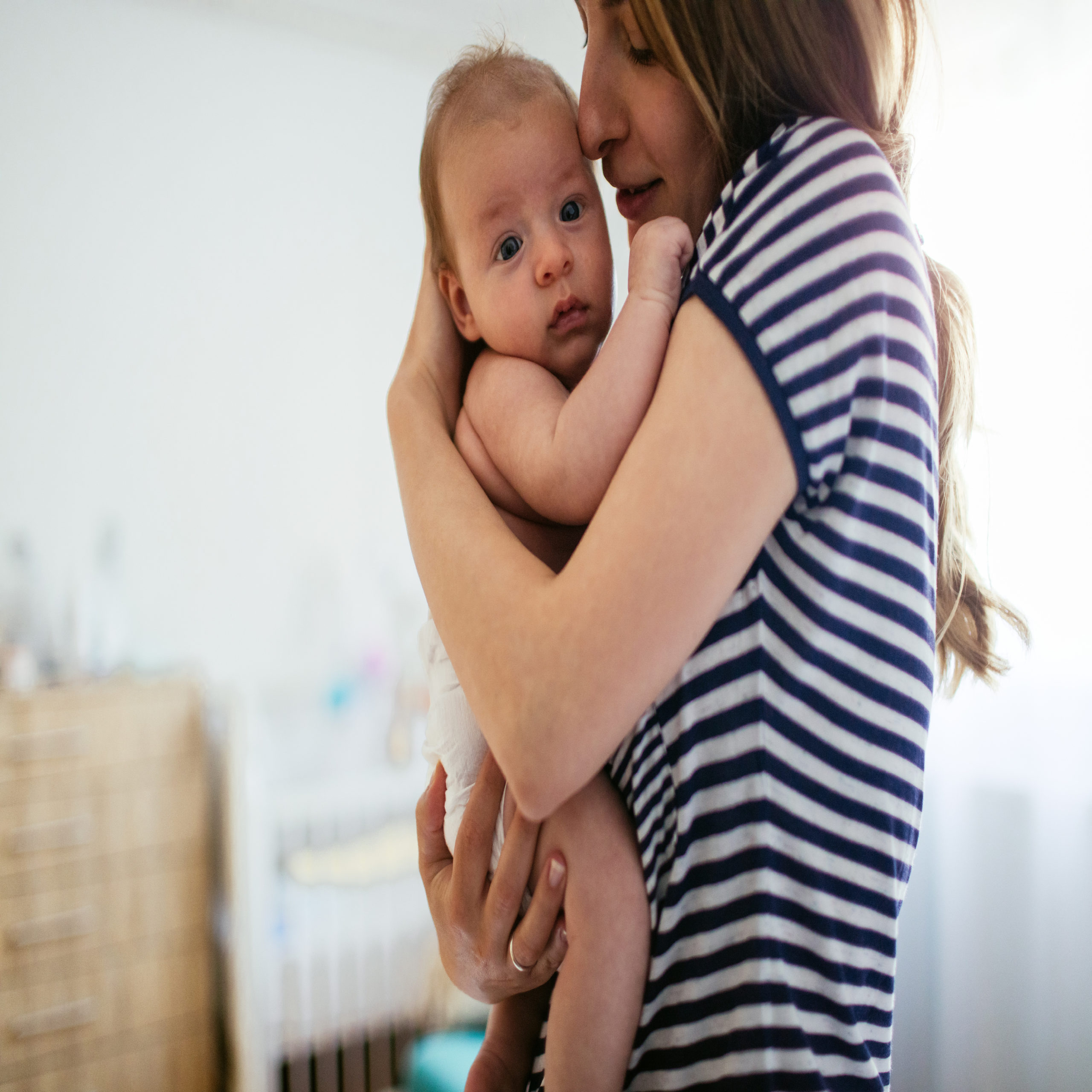 mom holding newborn baby