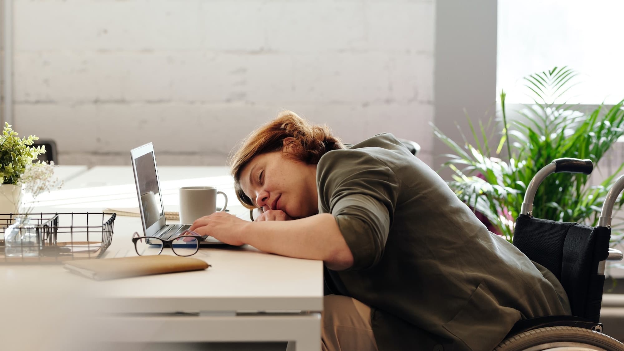 woman asleep on the desk