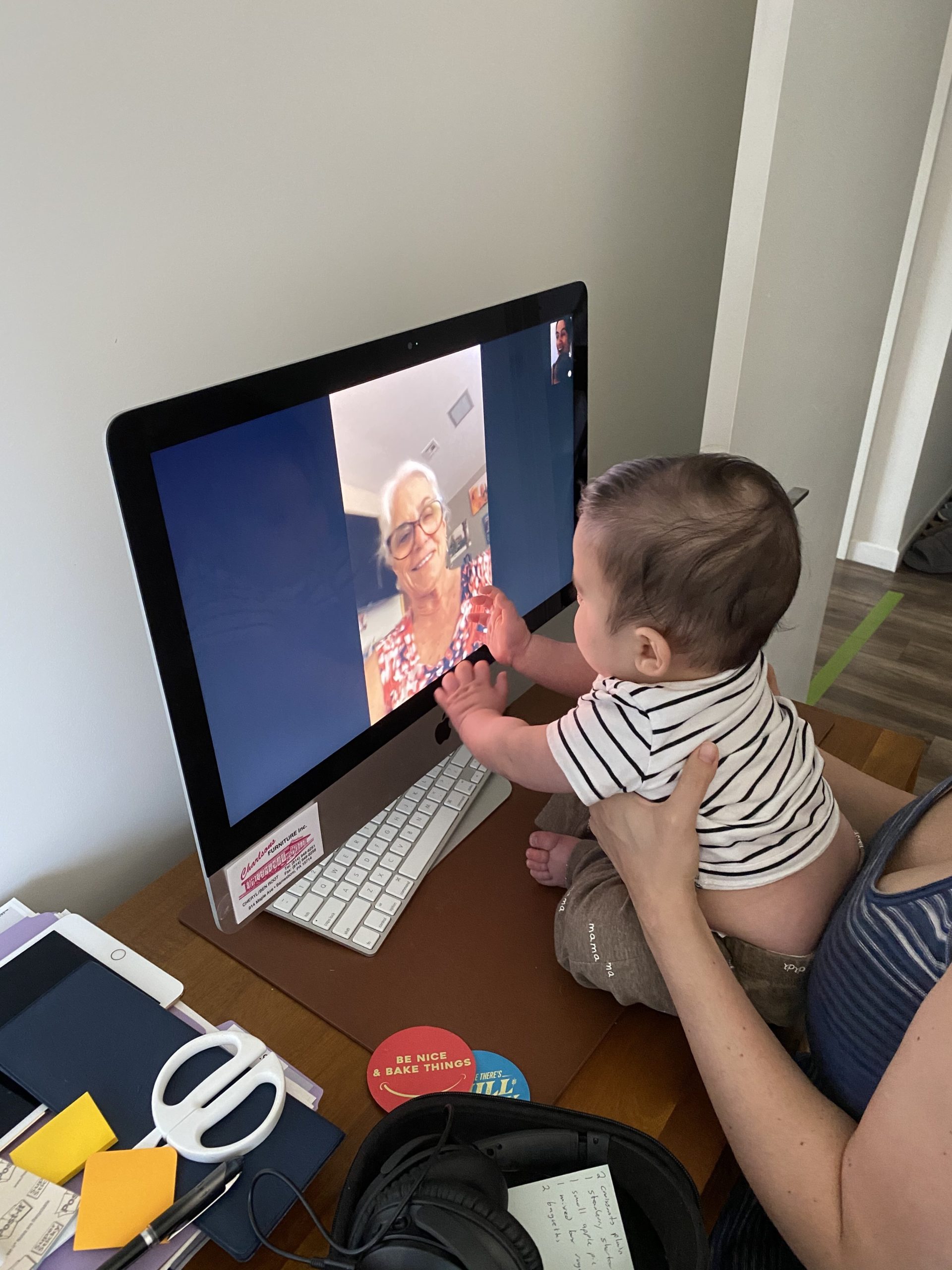 baby talking to grandma through a computer