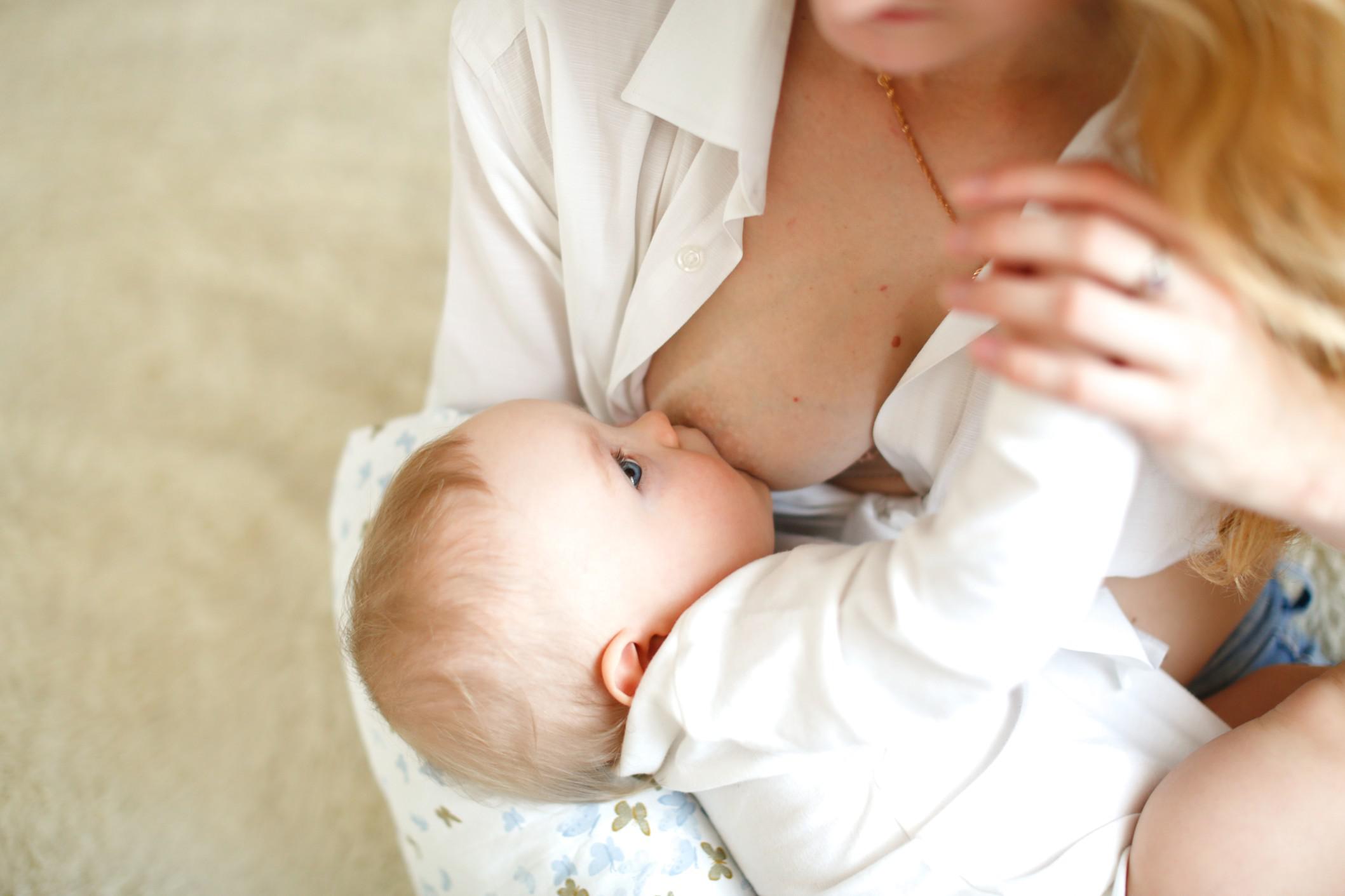 mom breastfeeding a baby - 10-week-old baby feeding schedule