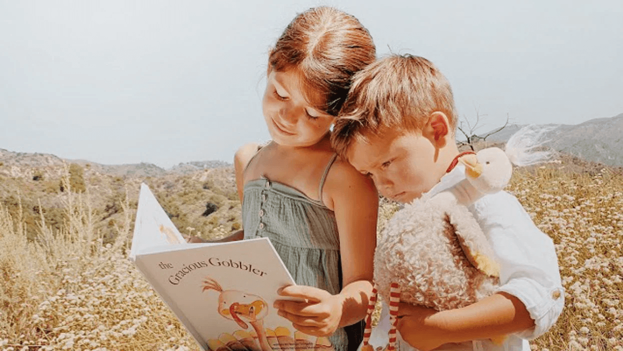 two-kids-reading-a-book-together