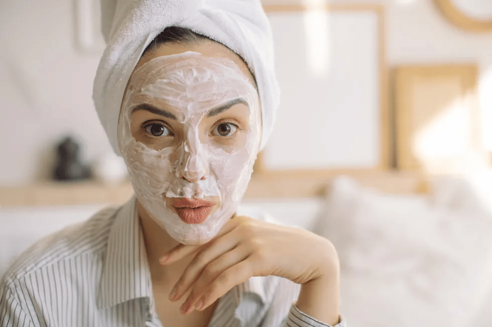 woman-with-towel-on-her-head-and-beauty-mask-on-face