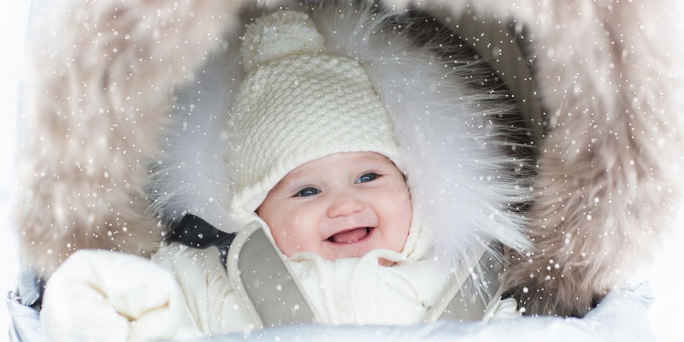smiling baby in winter coat- capricorn names