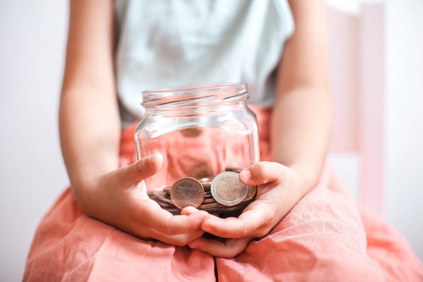 girl-holding-money-jar