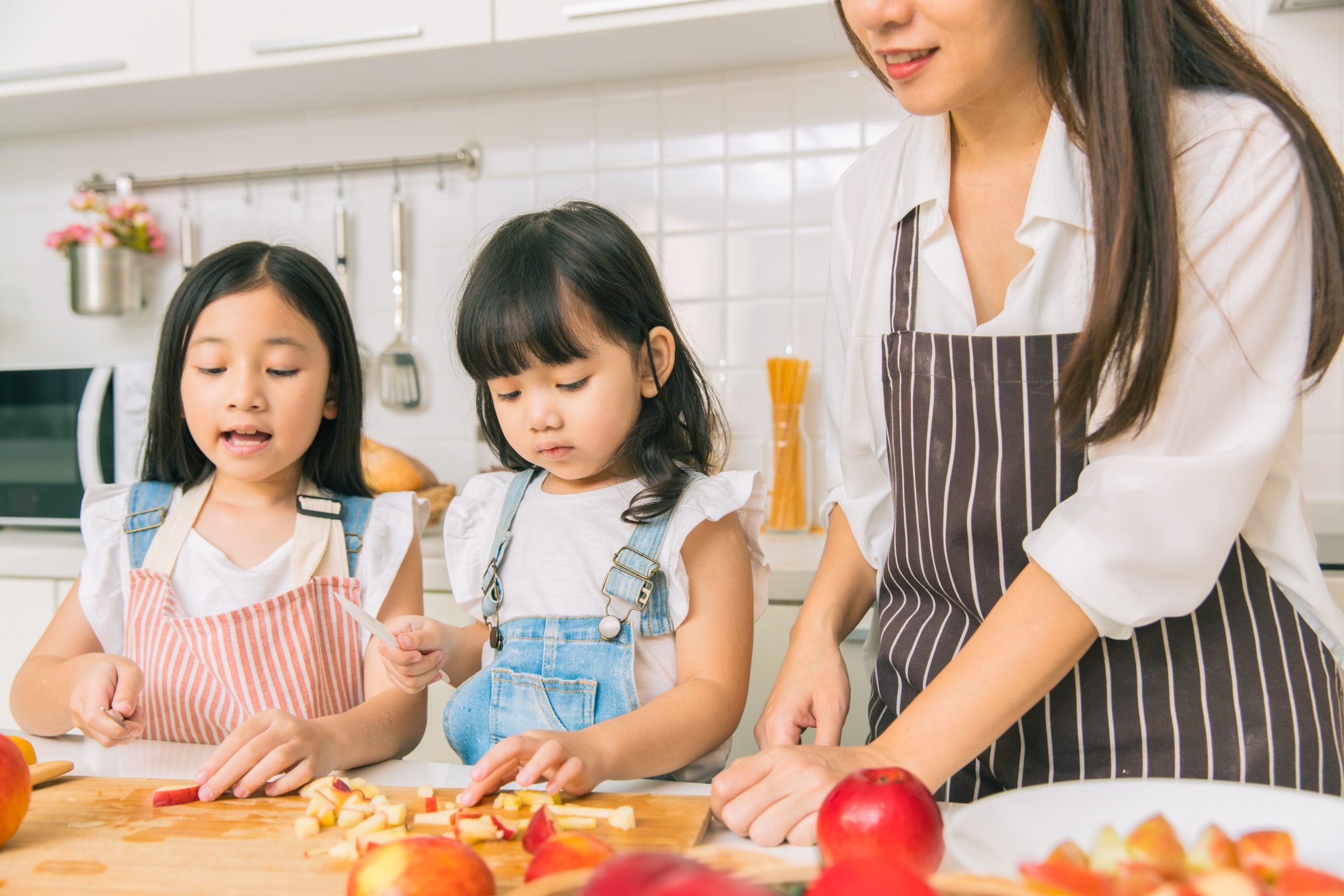 mom-and-two-daughters-cooking