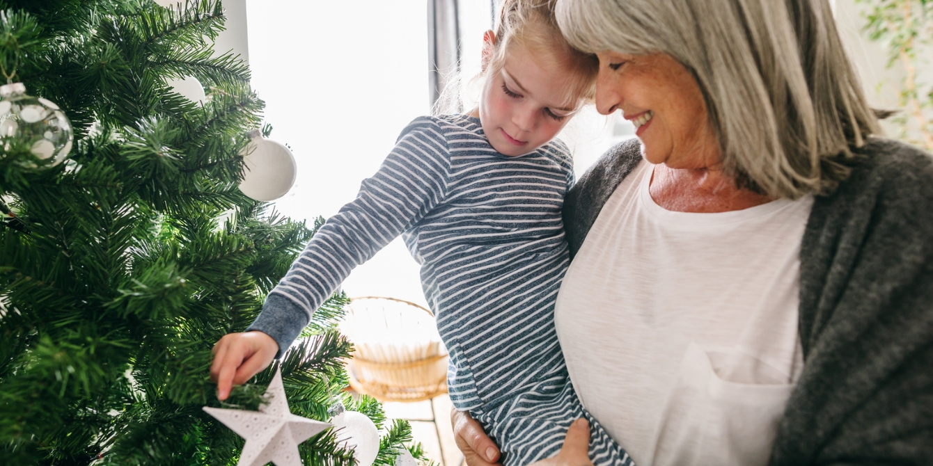 gifts for grandparents grandparent gifts grandma holding child decorating christmas tree