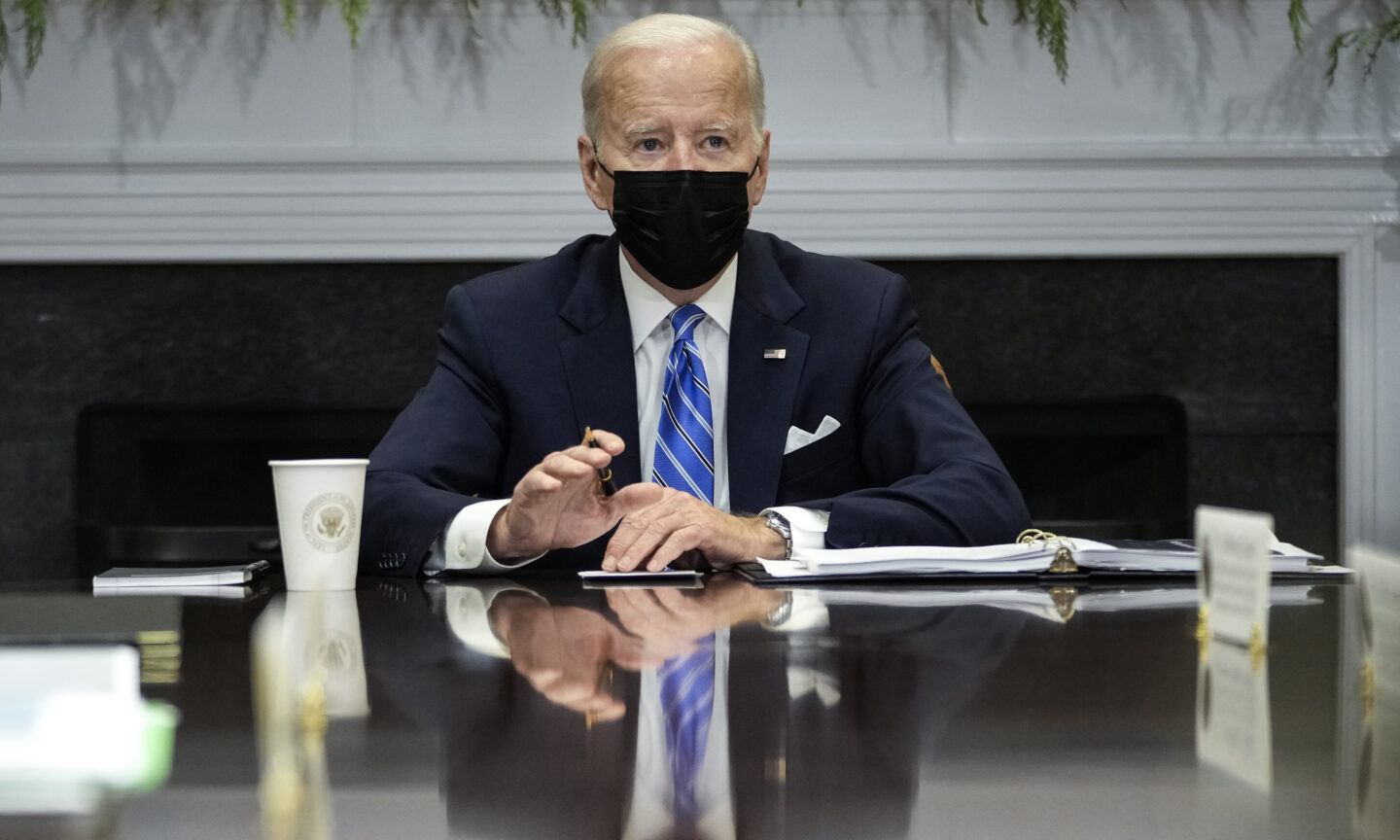 President Biden wearing a mask at White House desk