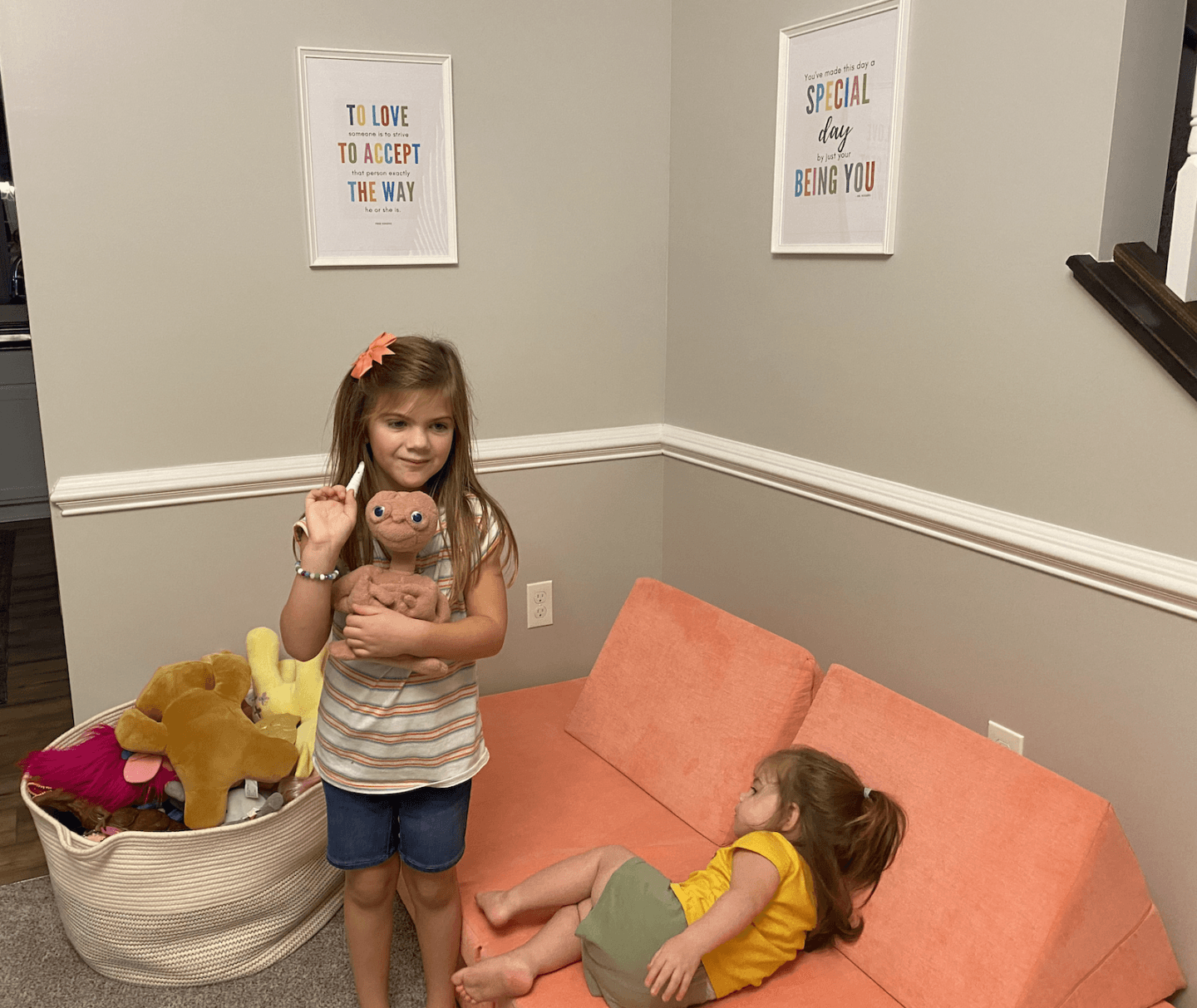 two kids playing with the Member's Mark Kid's Explorer sofa