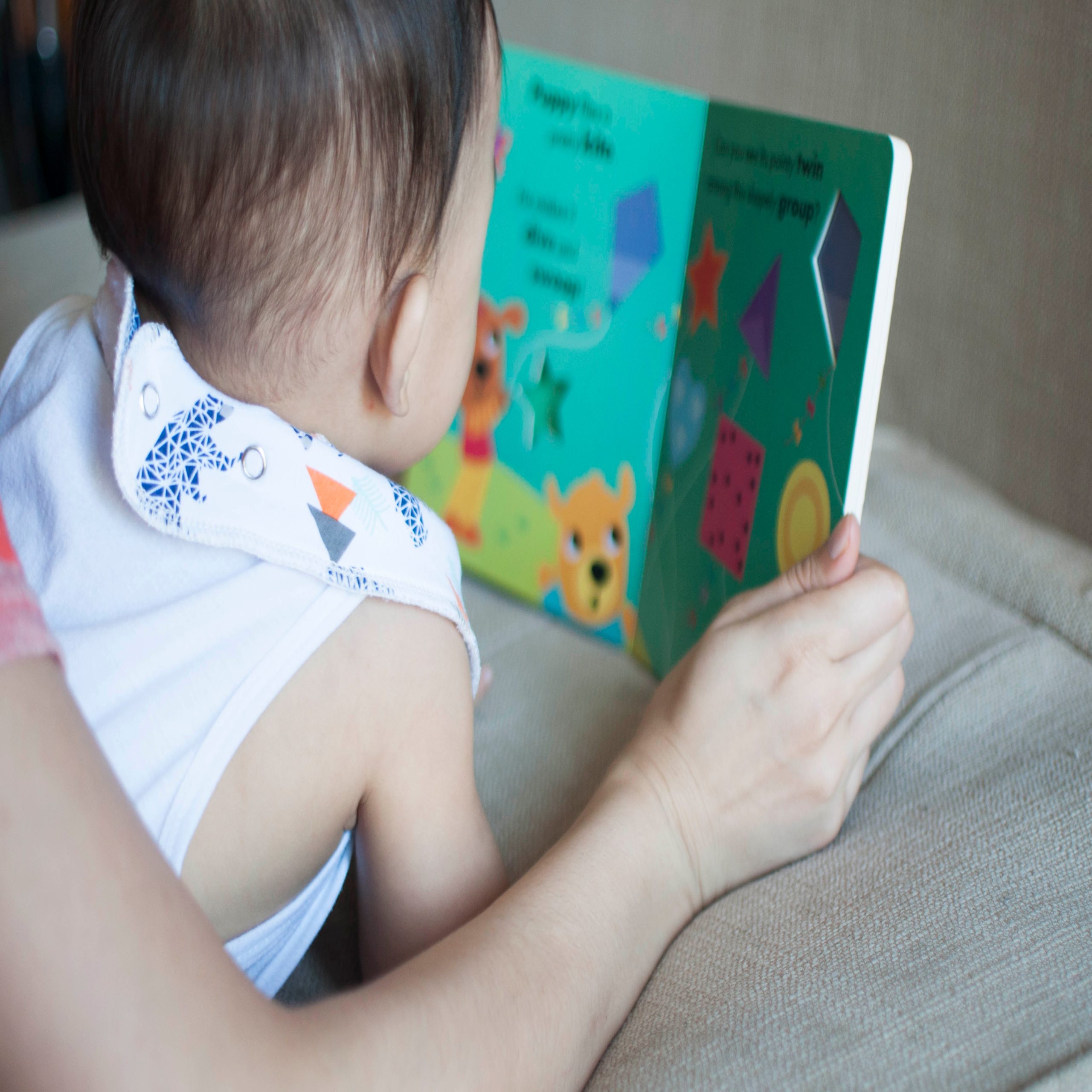 mom reading to baby