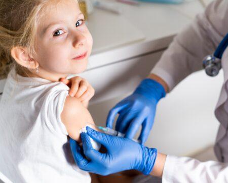 a little girl in the doctors office is vaccinated vaccination of children childrens preventive t20 9epw2K