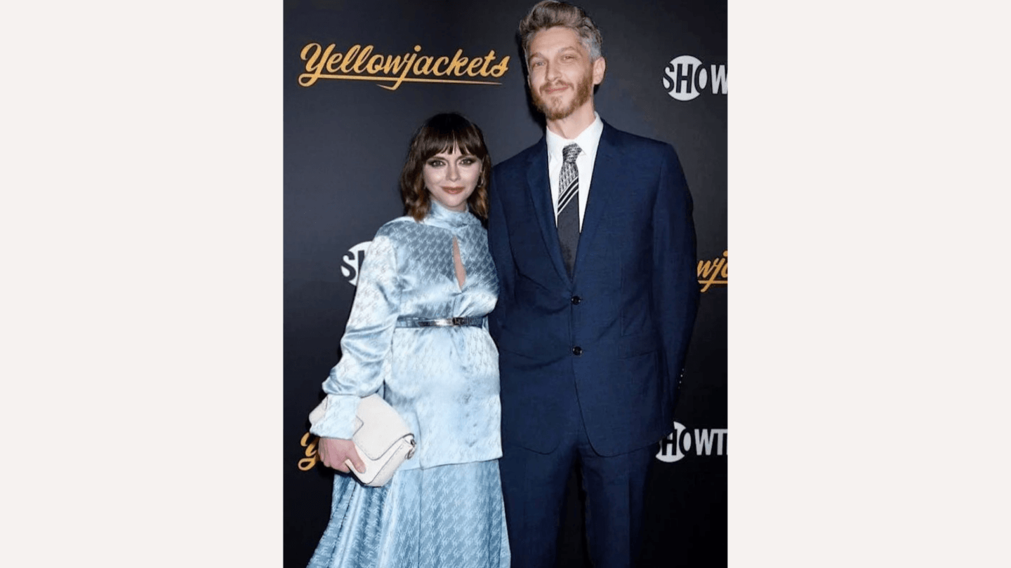 Christina Ricci posing with husband on red carpet