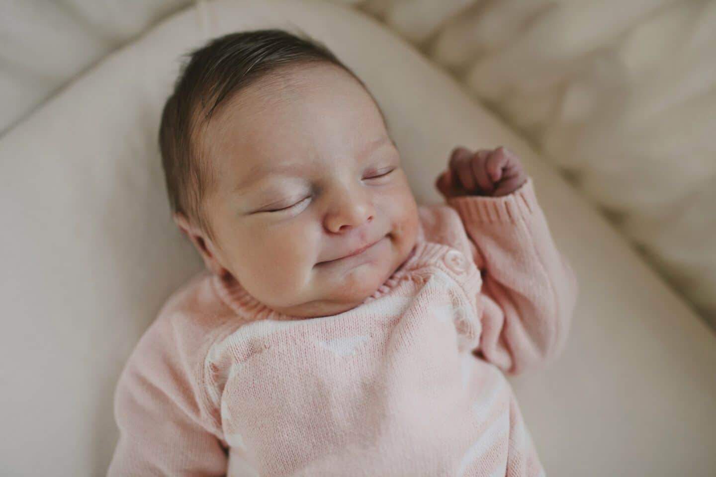 when should babies sleep in their own room: baby girl sleeping in crib