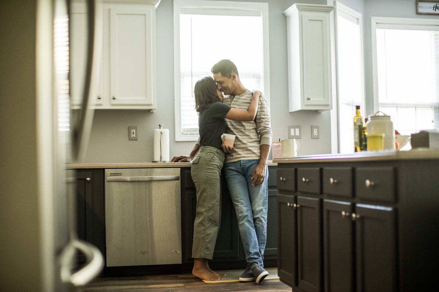 Marriage Husband and wife talking in kitchen