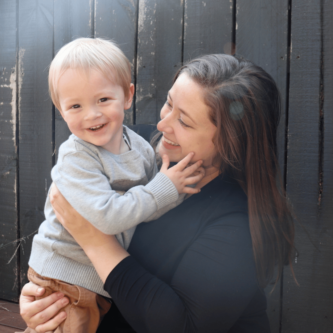 mom holding a toddler boy - essay on baby’s sleep issues