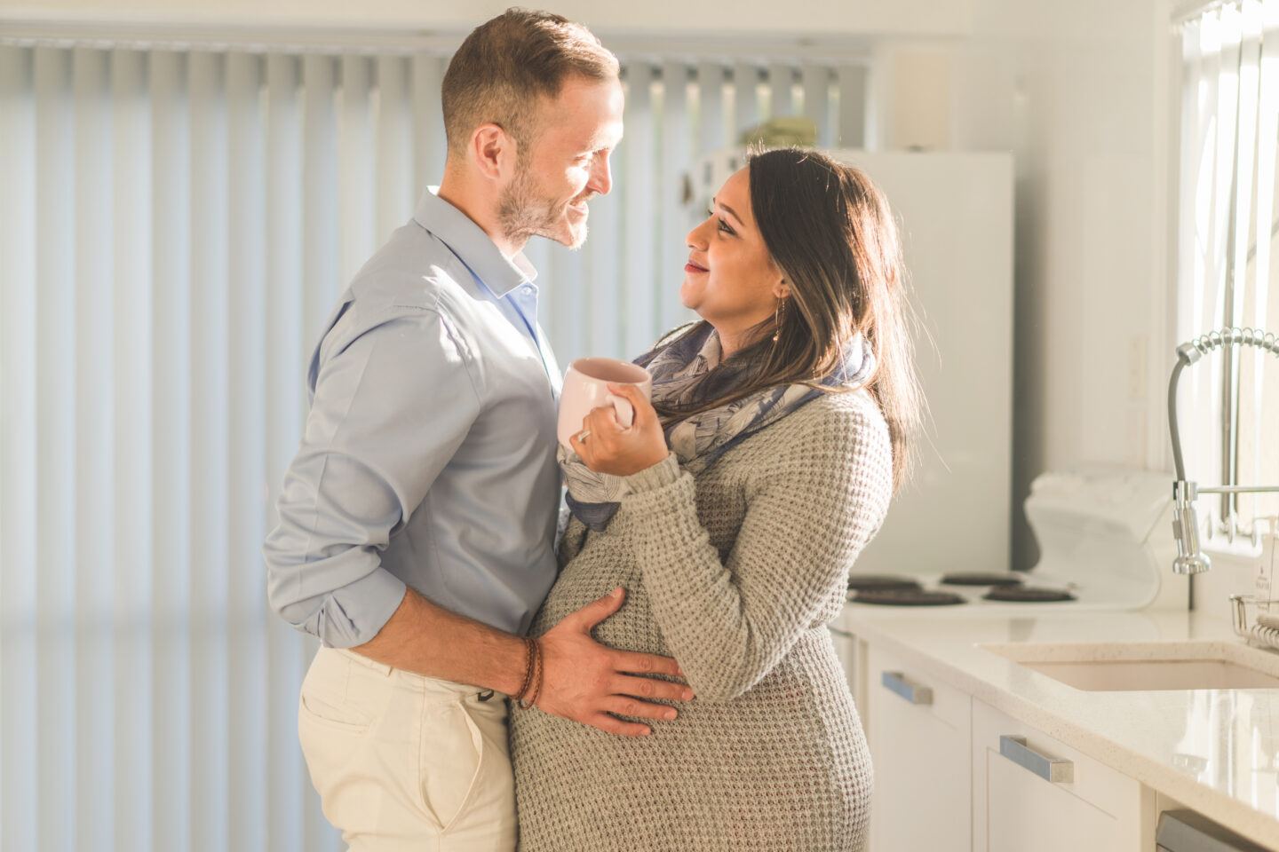 low libido: pregnant woman in kitchen with partner