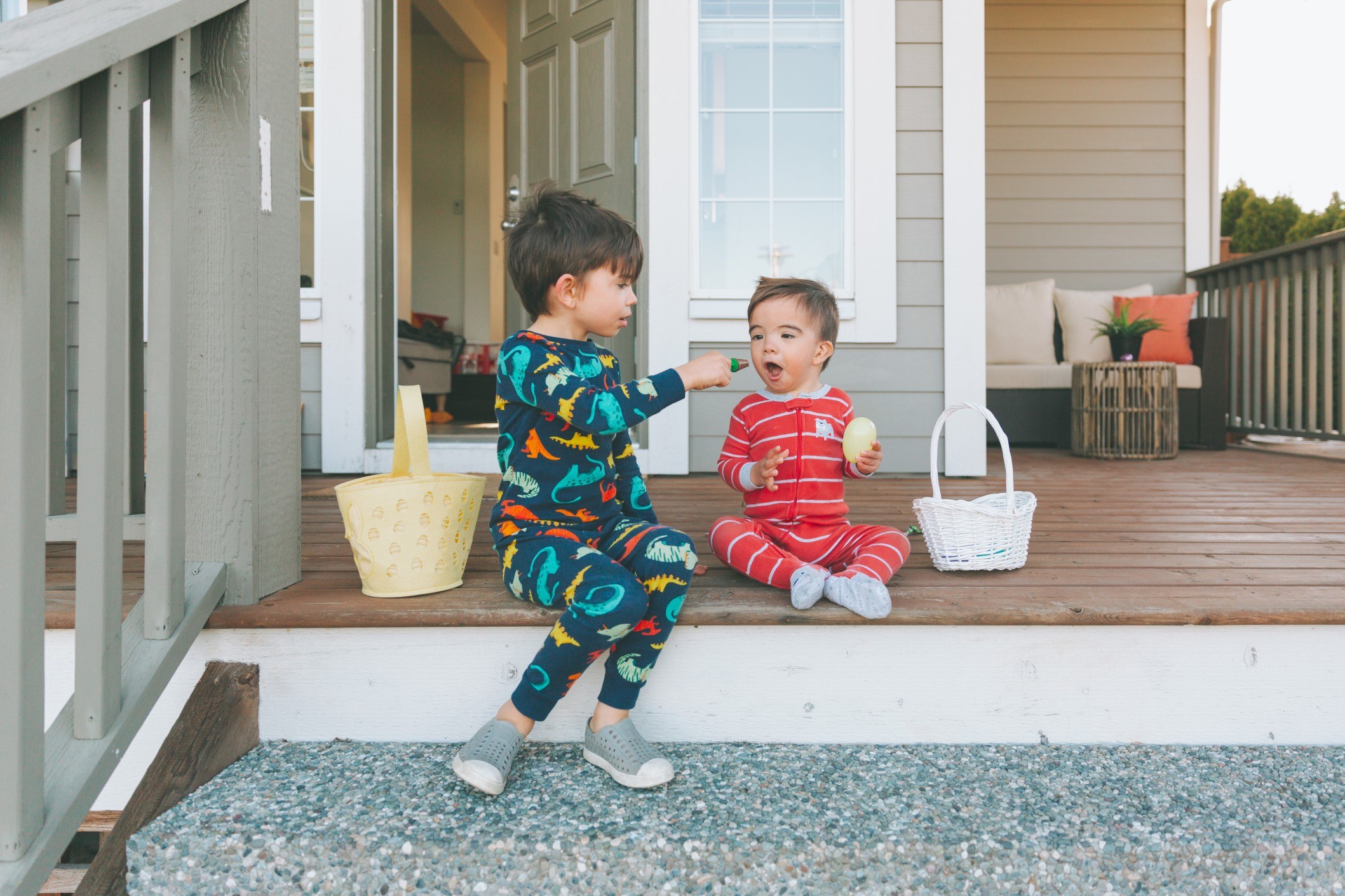 two brothers eating candy from their Easter baskets