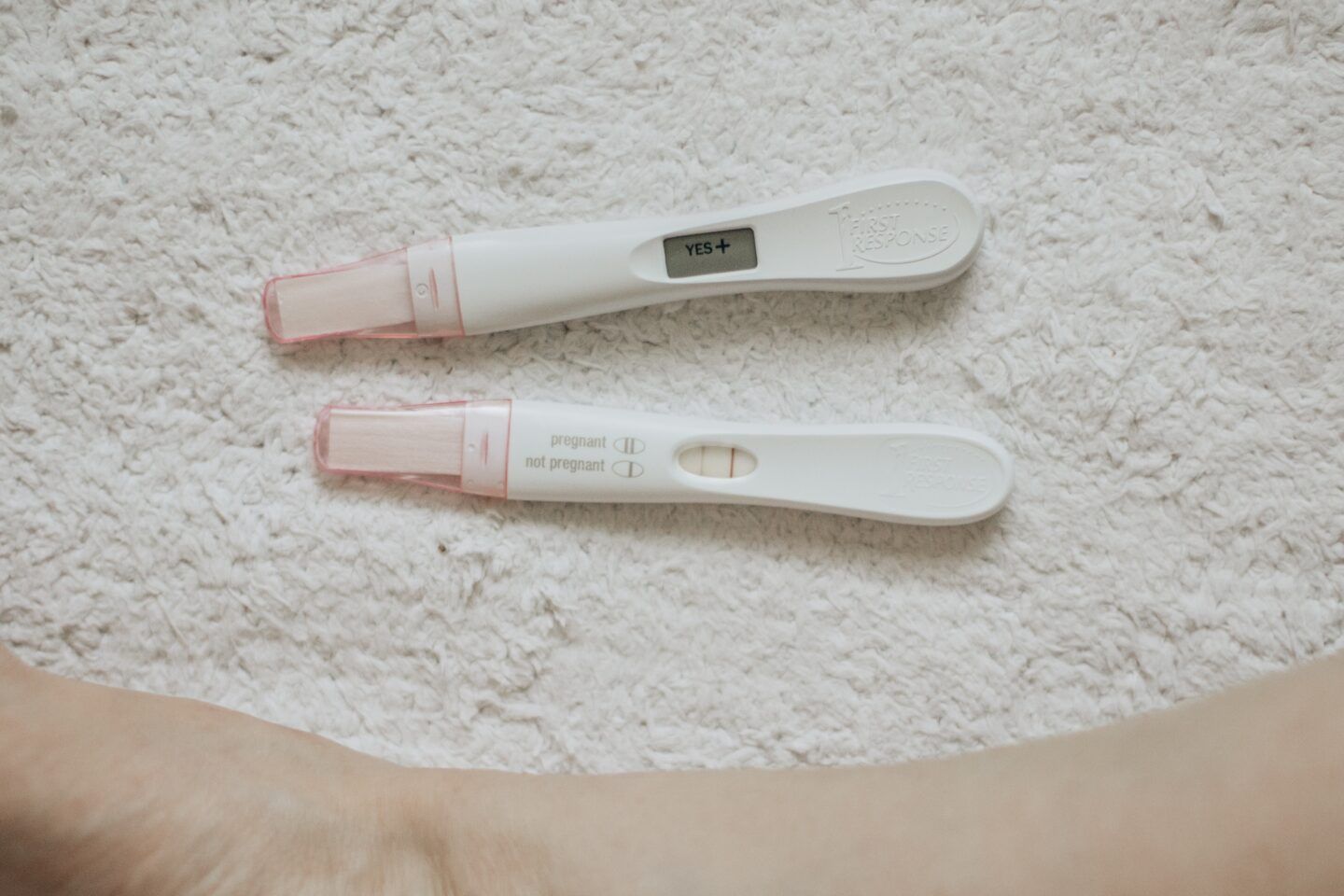 two positive pregnancy tests with one showing faint line on pregnancy test