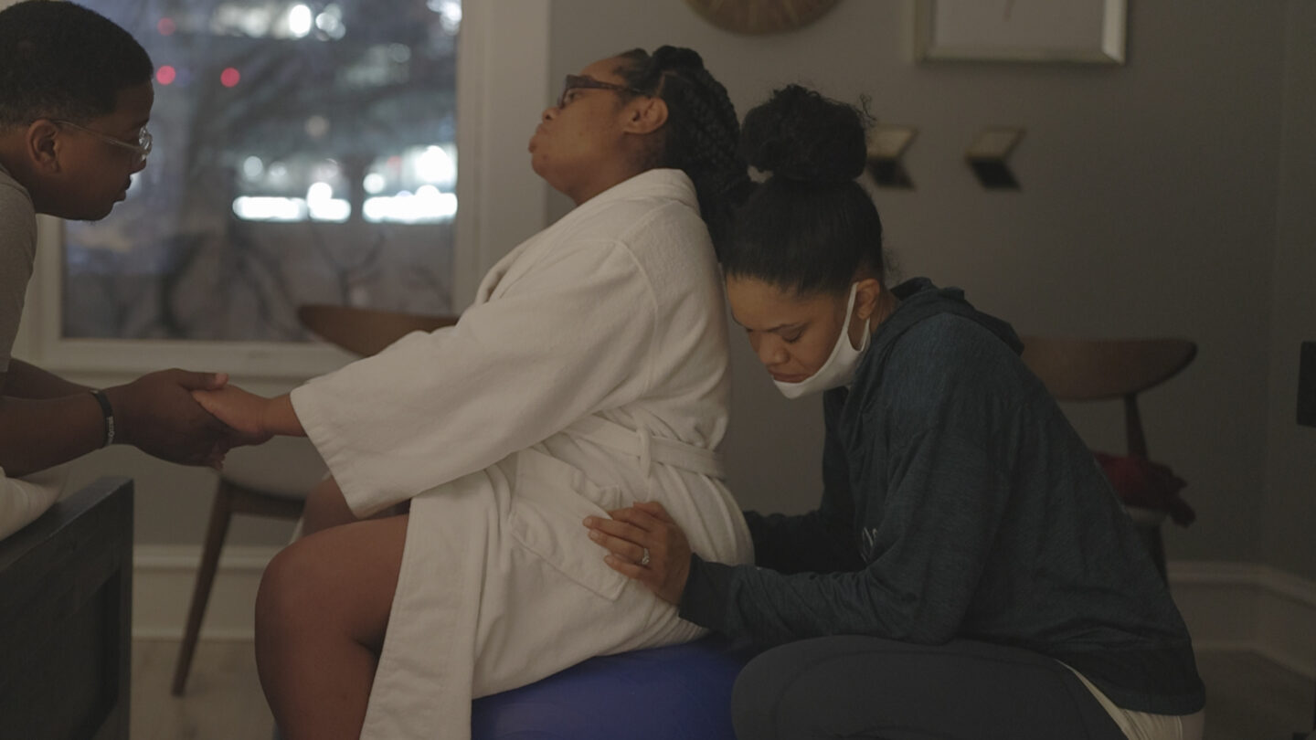 Midwife supporting mom in labor