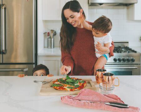 cooking cooking food kitchen family mother pizza home kids prepping making dinner t20 7y6ymj Motherly