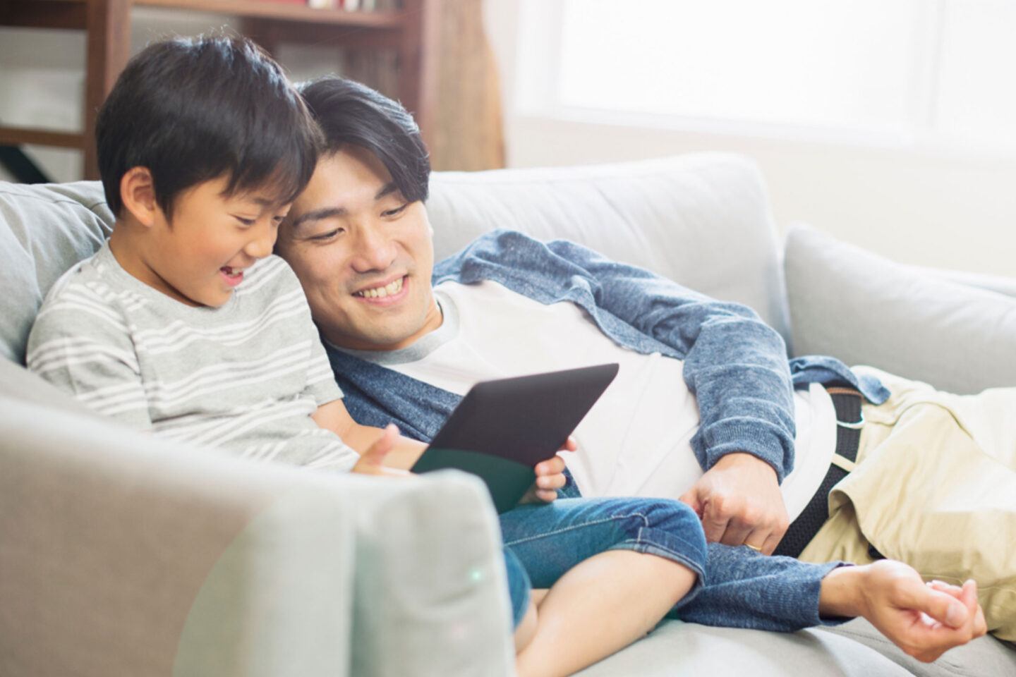 Dad and son using tablet