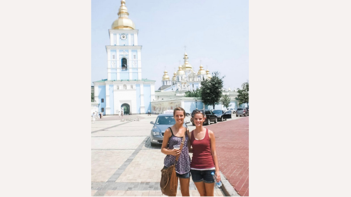 Friends in Ukraine: two young women in front of church in Ukraine